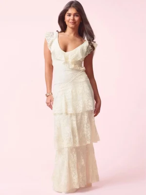 Vit lång spetsklänning med volanger (prom lace dress) - Prislappen är kvar. Helt ny endast testad. Romantisk långklänning i vit spets med flera lager volanger. Klänningen har v-ringning, breda spetsärmar och omlott-detalj upptill. Perfekt för sommarens speciella tillfällen och studentfirande. Totalt slutsåld på hemsidan