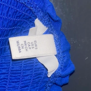 Blå tröja - Blå tröja utan ärmar