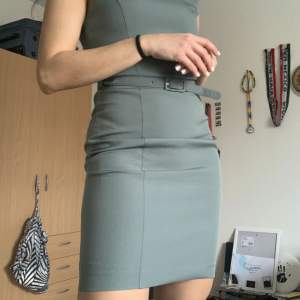 Midi olive/petrol dress for work. Has a belt, tight and flattering. New with tag