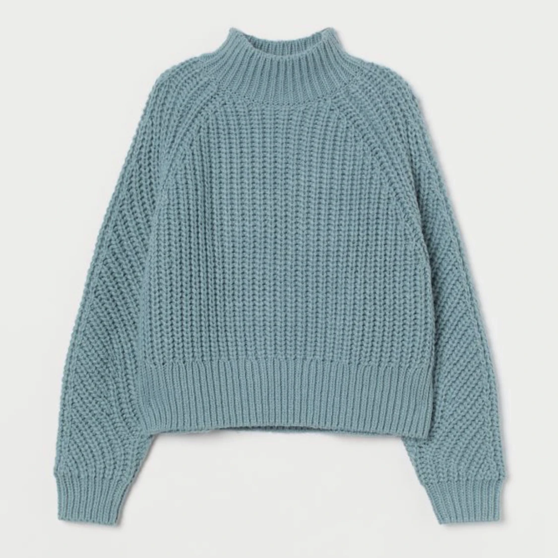 Turkos stickad tröja