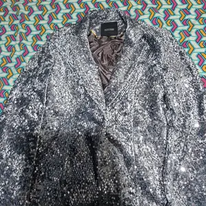 Silver fancy jacket for festive occassions.