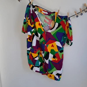 Odd clown retro shirt - Very quirky, fun and colourful shirt with crazy pattern on. Fits like a size S/M.