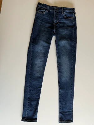 LEVI’S SKINNY JEANS - Cut the tags too soon :( I’ve worn and washed them once but they don’t fit quite right. They’re basically new, size 26. They’re blue denim. 