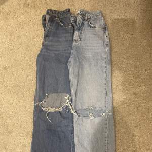 2 par jeans strl 32 med stora hål på knäna. 1 par från Ginatricot och 1 par från H&M.