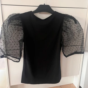 Svart topp - Svart topp