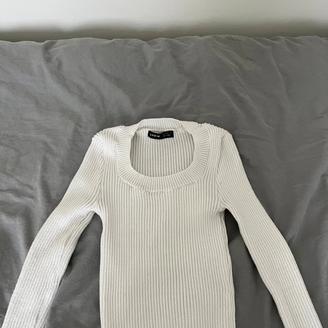 Långärmad stickad tröja