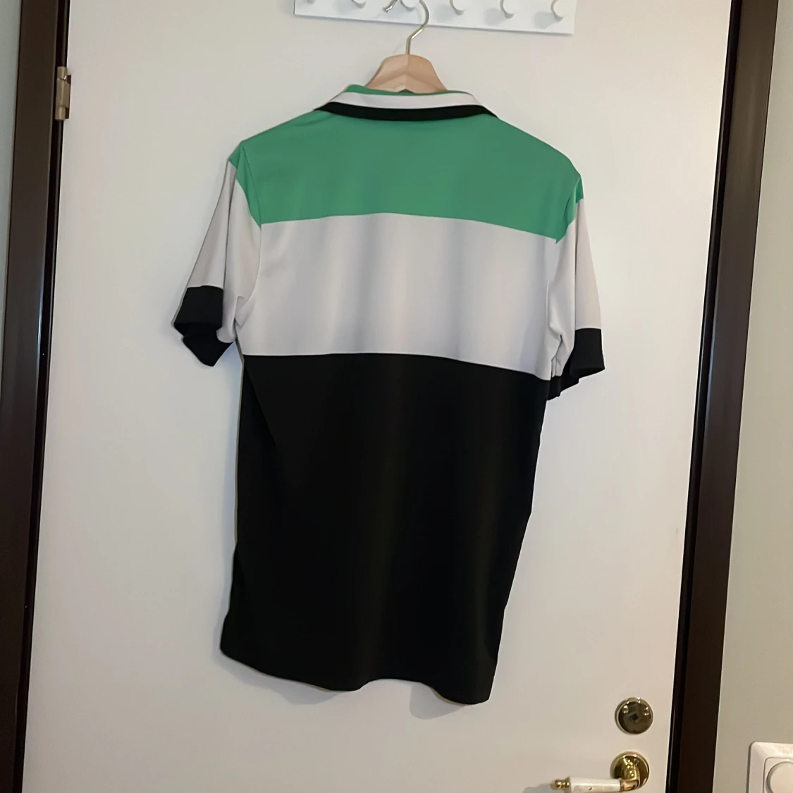 Grön och svart pikétröja från Puma - 91