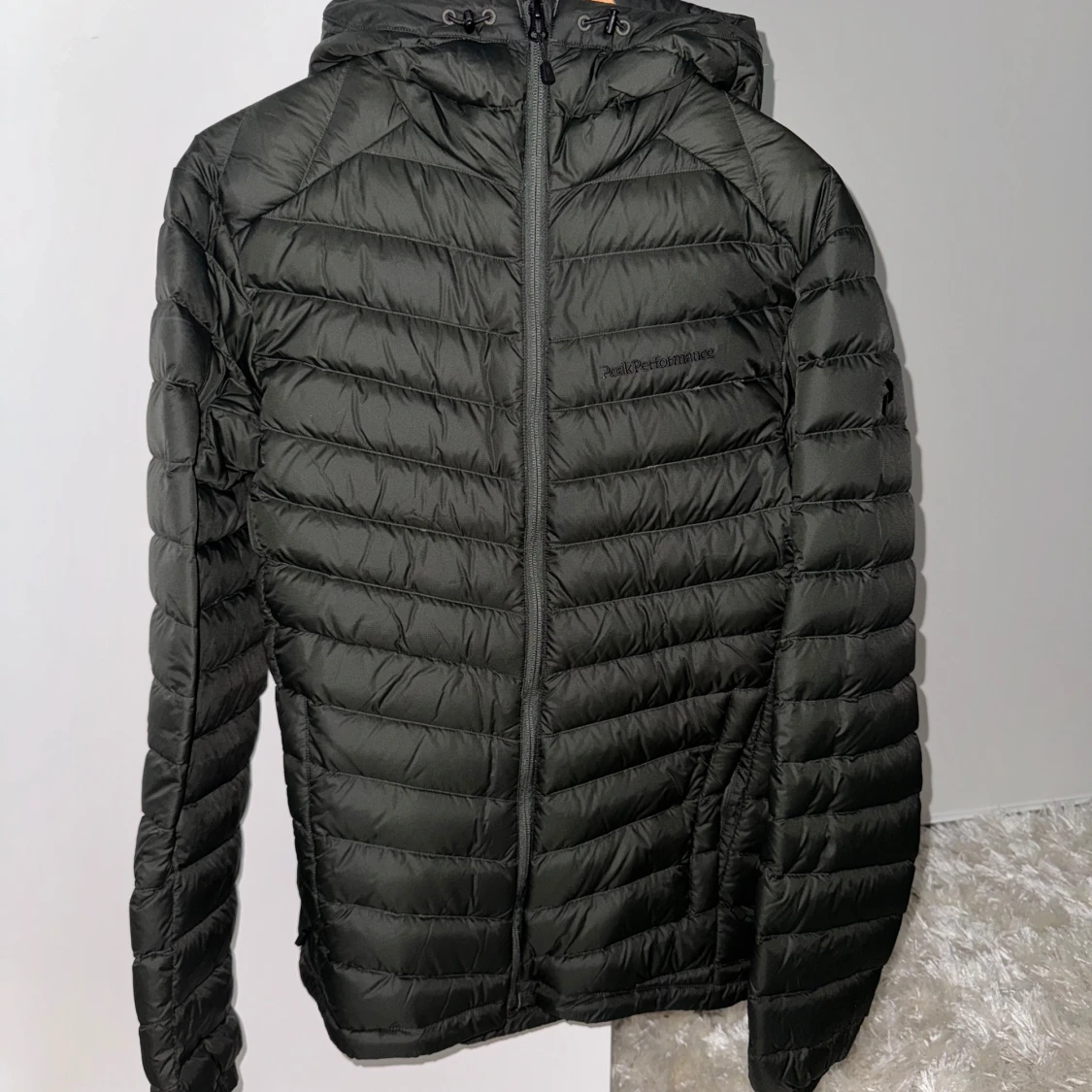 Grön dunjacka Peak Performance
