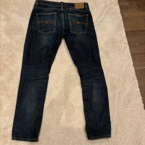 Nudie Jeans - Säljer mina feta Nudie Jeans. Modell: Lean Dean, Troubled See. Nypris runt 1700 kr! Storlek 31:30 Kan gå ner vid smidig affär!