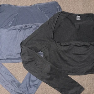 svart och blå/grå croppad topp från Shein - två snygga croppade toppar från Shein i svart och blått/grått. perfekta för en vardaglig men även elegant stil. de är långärmade och gjorda i ett stretchigt material som sitter jätteskönt på kroppen. jättelätta och sköna!! (passar även S)