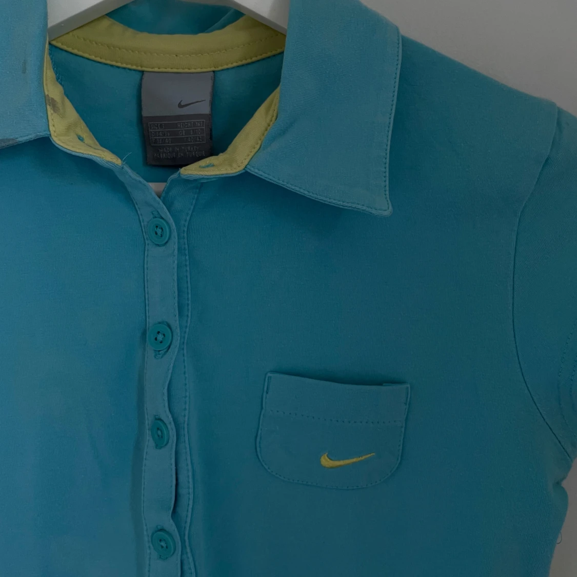 Turkos pikétröja från Nike - 90