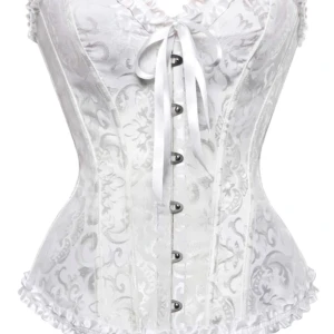 Vit korsett med knyt och knappar - Vit korsett med vackert mönster och knyt framtill. Den har en v-ringad design som ger en stilfull look. Köpte två stycken och denna passade inte mig! Perfekt nu till halloween💕💕 