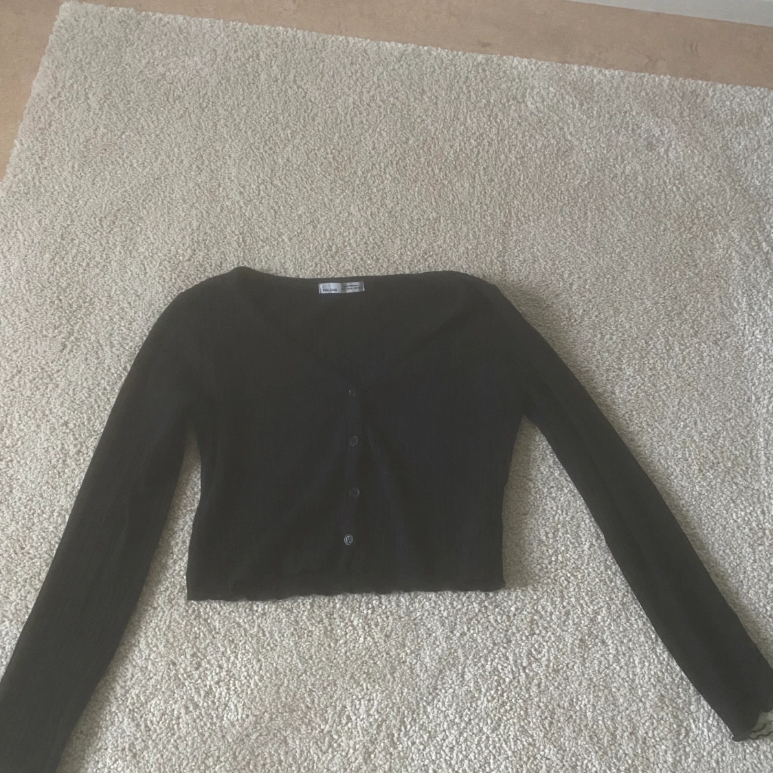 Långärmad topp i strl S