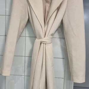 Kappa beige  - Jätte fin kappa. Storlek m 