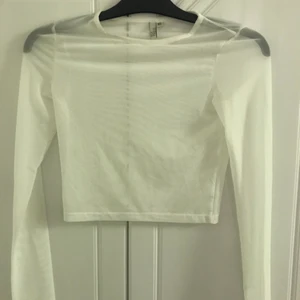 Vit genomskinlig topp - Oanvänd genomskinlig topp.