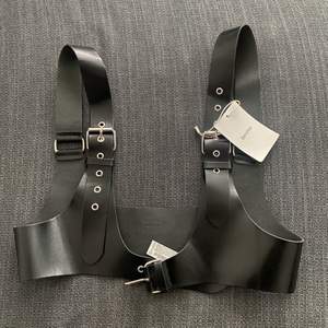 Black leather harness from bershka never used still with the tag on size 34