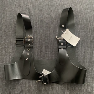 Bershka harnesses  - Black leather harness from bershka never used still with the tag on size 34
