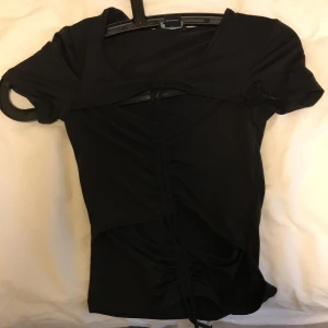 Black top for girls - This is barely used, I showed how it looks on a stuffed animal so you can see how it fits.