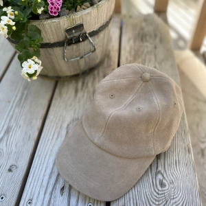 Suede Baseball Cap - Classic baseball cap in a suede finish, with an elasticated fit and topstitch detailing.