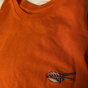 Evisen skateboards. T-shirt orange - Bra skick. 