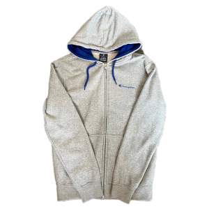 En grå champion zip-up hoodie i storlek M i mycket bra skick 