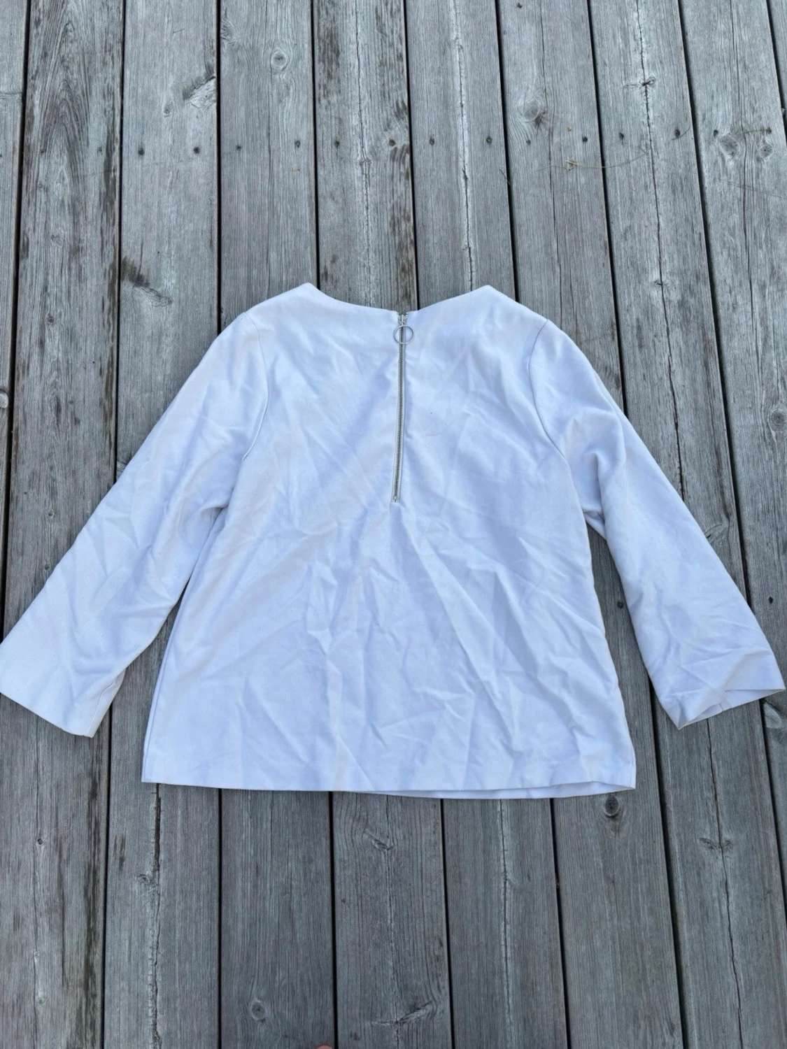 Vit blus med dragkedja bak - 1