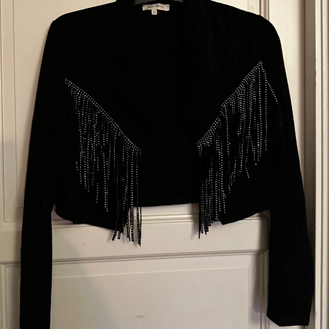 Svart mockajacka med fransar