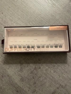 DuffBeauty lösögonfransar modell Wisp - DuffBeauty lösögonfransar modell Wispy, 14 mm. Nya/oanvända, 12 stycken.