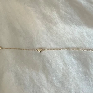 Guld armband - Guld armband med hjärta 