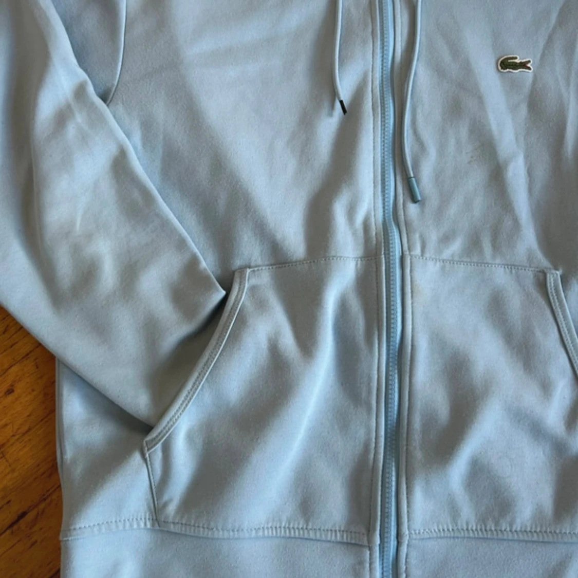 Ljusblå Lacoste hoodie - 1