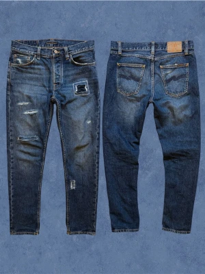 CUSTOM NUDIE STEADY EDDIE - Ett par sjukt unika nudie jeans i straight fit! Sjukt snygga slitningar, 1 of 1. Storlek 29/30 passar 30/30. Hör gärna av dig!