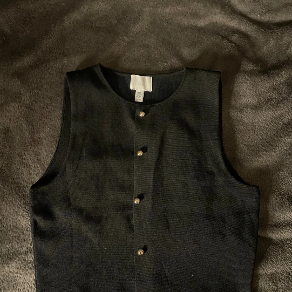 Svart croppad väst med knappar