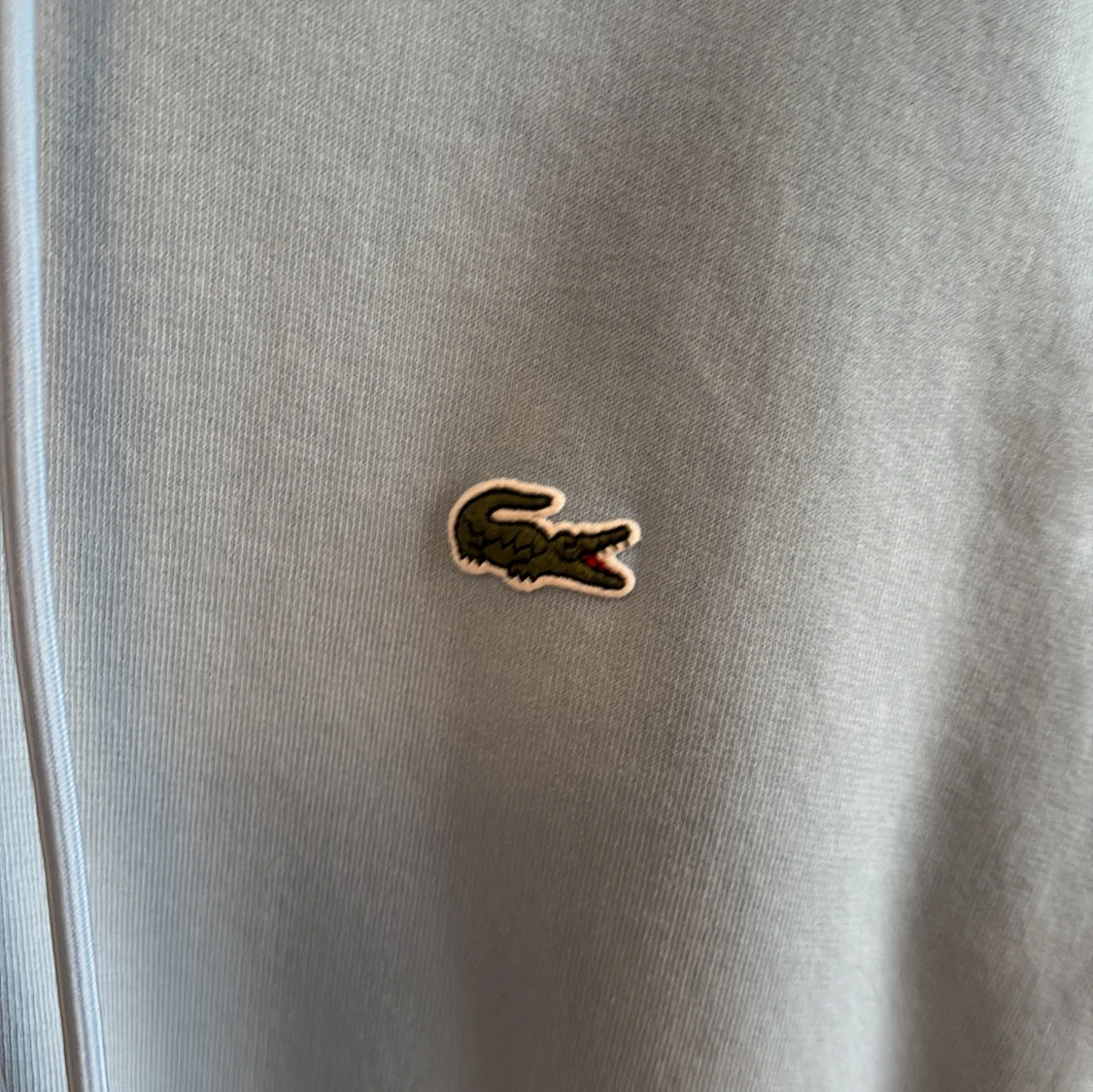 Ljusblå hoodie från Lacoste XS - 2