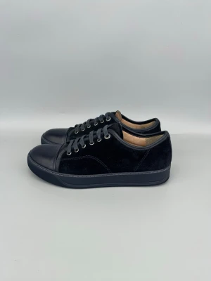 Lanvin DBB1 Nappa Cap Toe Sneaker Navy -  • The shoes have been gently used and are in very good condition  • Size: EU39 / UK5 (fits 40)  • Color: Navy  • Retail price: 5000 SEK / 450€  • No accessories