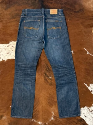 Dry Nudie SlimJim - Tjena! Säljer dessa riktigt feta Vintage Raw Nudie SlimJim, modellen är Slim och är u storlek W34/L34, hör av dig vid funderingar!🙌
