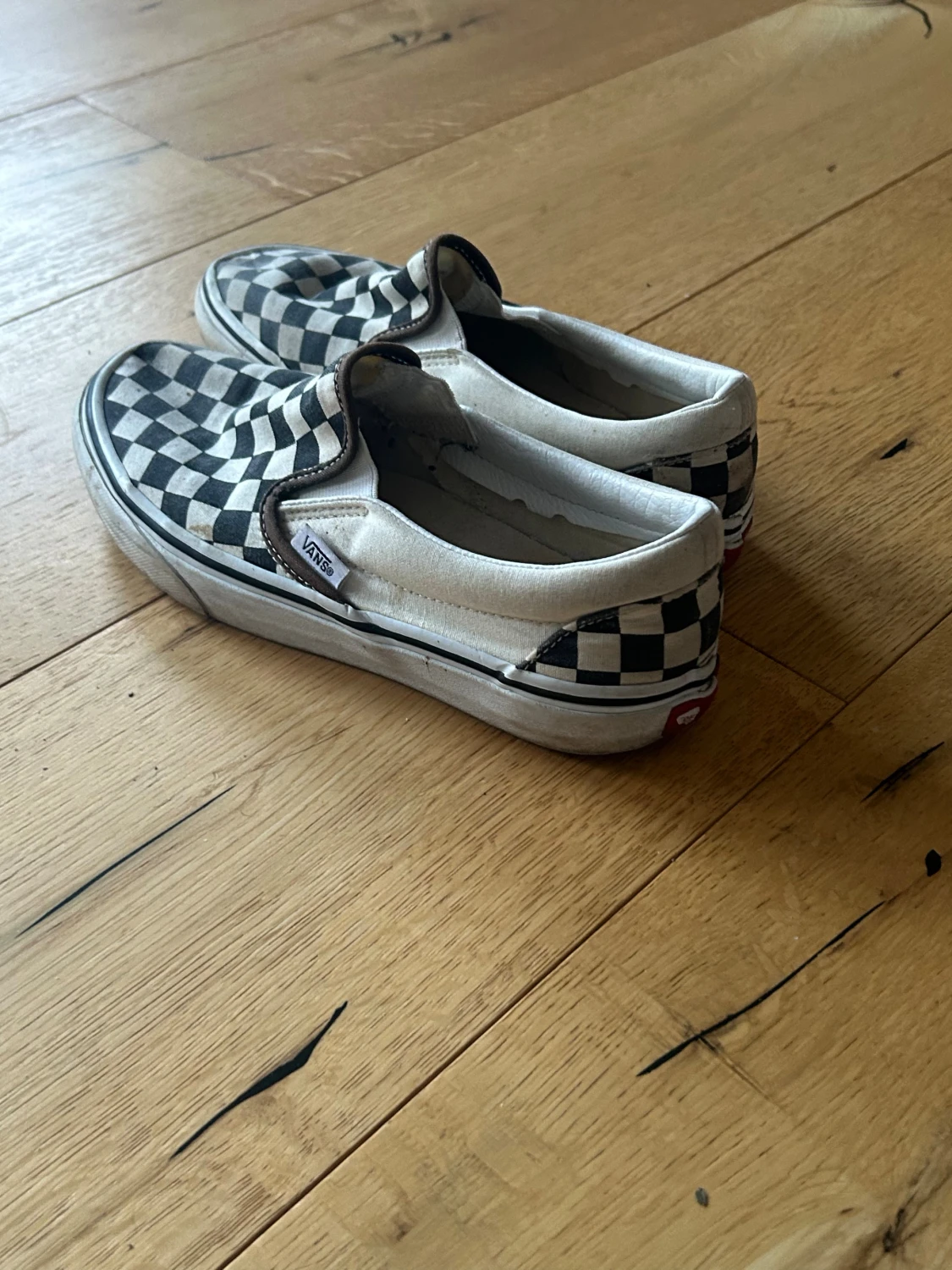 Svarta och vita Vans slip-on checkerboard