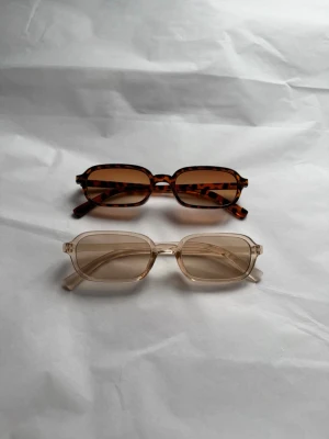 Solglasögon 2 st - Helt nya har aldrig kommit till användning. Båda solglasögonen medföljer för priset