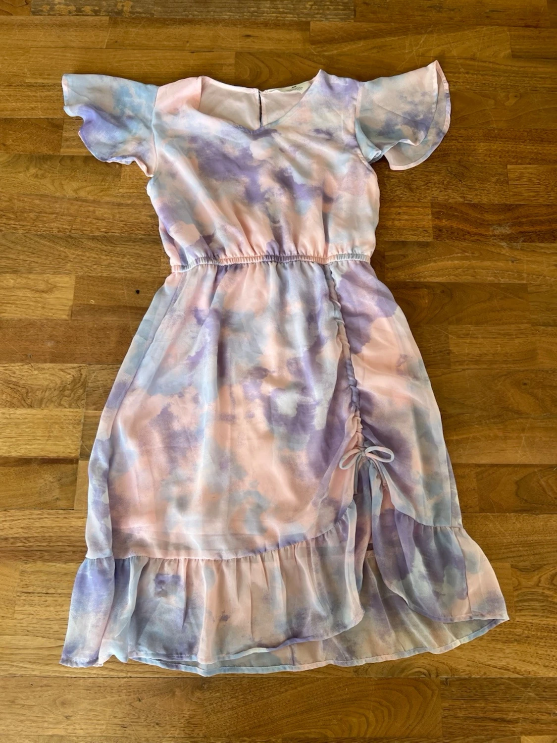 Pastellfärgad omlottklänning