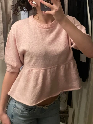 Ljusrosa stickad topp - Ljusrosa stickad topp från Nelly 