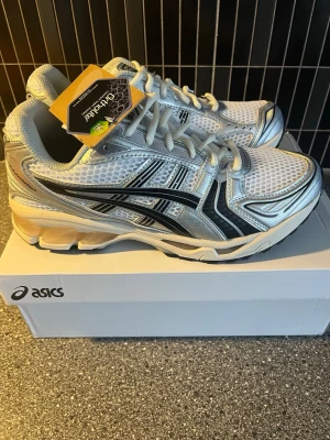 Asics kayano 14 - Selling a brand new pair of ASICS GEL NYC in a clean graphite grey and black colorway. These are one of the most trending sneakers right now, seen everywhere in streetwear and fashion.  * Brand New * Comfortable GEL cushioning * Modern Y2K / lifestyle runner design  Perfect for everyday wear, streetwear outfits, or as a clean pair of sneakers for all seasons.