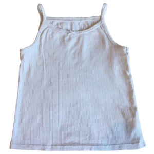 Pointelle baby tee-linne/ topp/ rosett, y2k/ cyber/ alt/ coquette/ 2000s/ 2000tal - Gulligt hålmönstrat linne! Barnstorlek men passar ca XS/S 