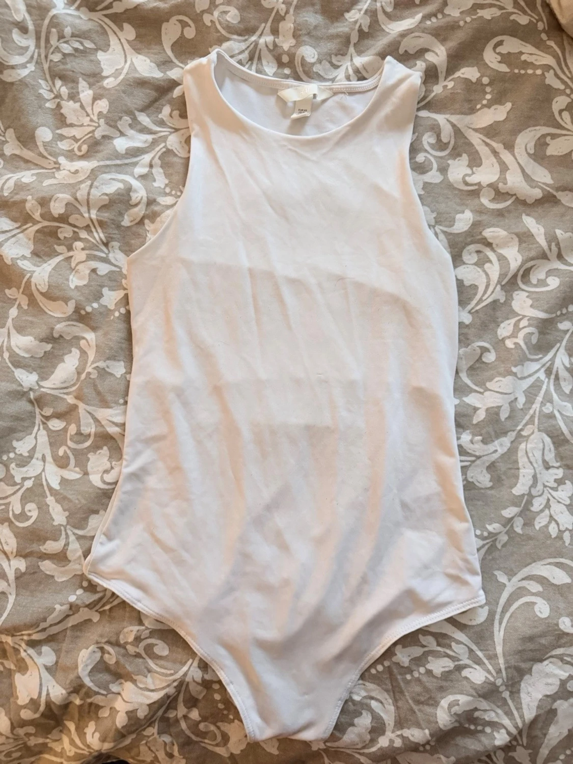 Vit ärmlös body från H&M