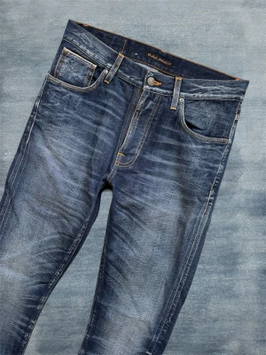 *SELVAGE* NUDIE LEAN DEAN - Ett par extremt fina jeans av nudie gjorda i högkvalitativ selvedge! Modellen kallas ”Lean Dean - Erik Replica” och sitter slim! Storlek 31/32 - Hör av dig vid frågor!