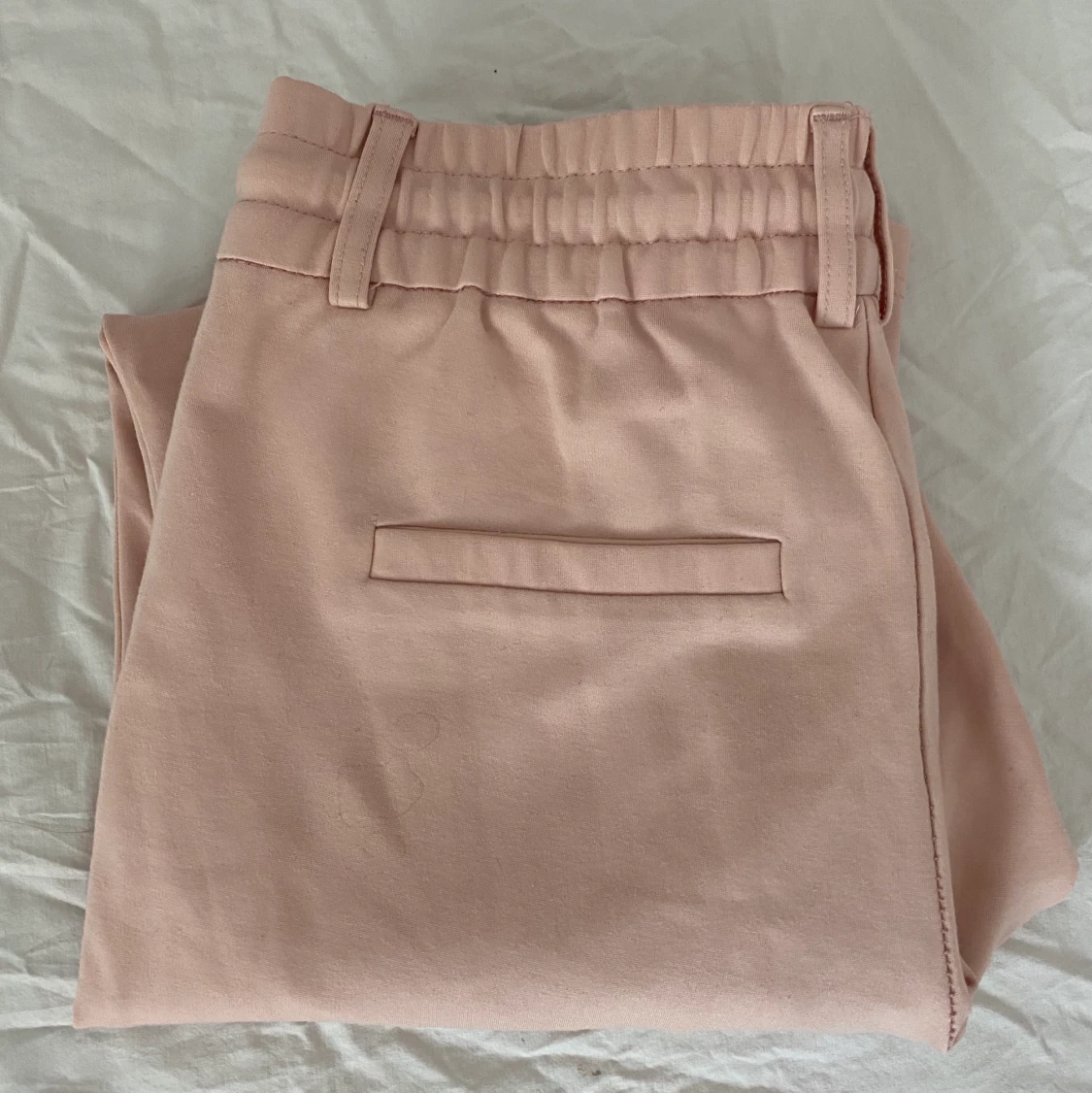 Ljusrosa kostymbyxor