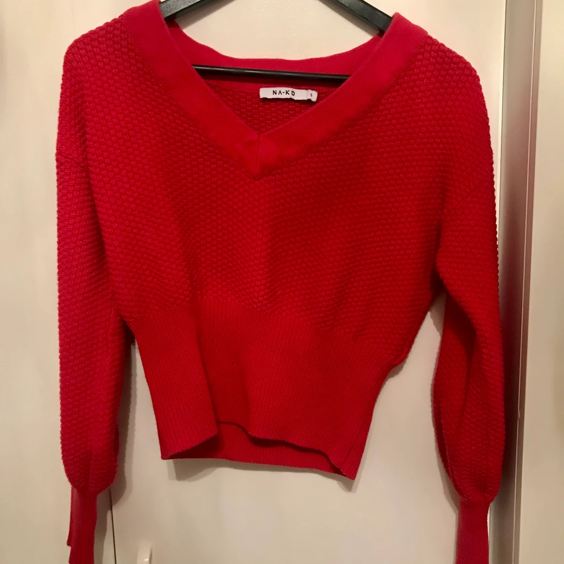 Röd stickad tröja
