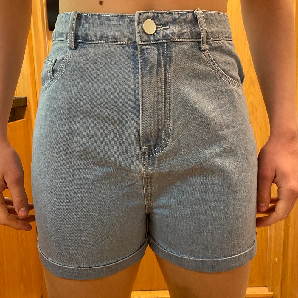 Brand new shorts, never worn, good quality, cute pocket detail, light wash denim colour, size M but fits S-XS.. Shorts.