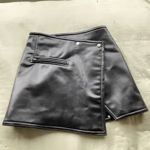 Black leather skirt from WEEKDAY. Size 36