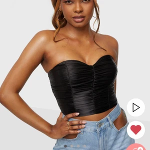 Topp - Jättefin korsett-inspirerande topp från Nelly. Helt oanvänd med lapp kvar. Egna bilder kan skickas vid intresse