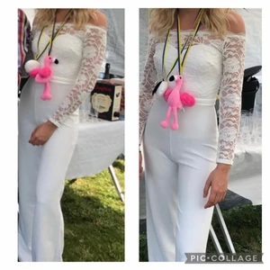 Vit byxdress  - En fin byxdress från nelly i strl 34. Använd 1 gång för foto, jag är 174 och den är lång. Ordinarie pris 700 men jag säljer den 500