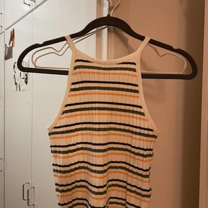 Divided Striped Top (H & M) Size S - Bought this top this year, it’s very cute and has orange black and green stripes. Fits very well as a small. It’s in practically new condition. 